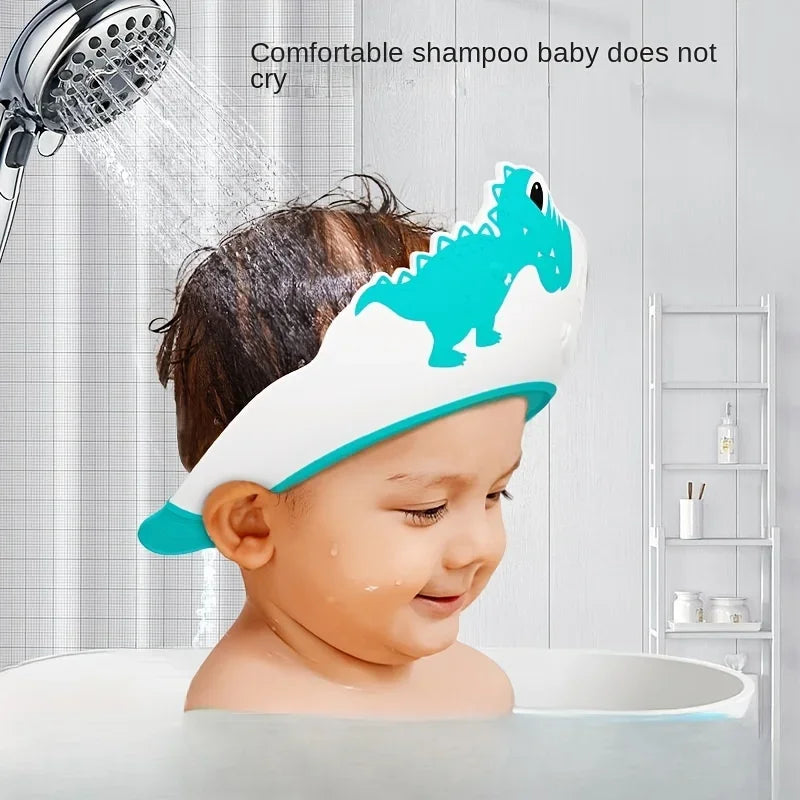 "🦖 Transforme o Banho do Seu Pequeno em uma Aventura Divertida com o Chapéu de Banho Dinossauro Ajustável! 🛁"